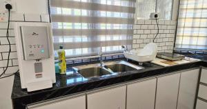 Photo de la galerie de l'établissement Beril Homestay Full Aircond, Free Wifi, Netflix, Water Filter, à Paka 7 autres photos