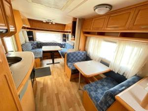 a kitchen and living room of an rv at Your Camp Kormoran in Hel