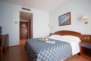 Postelja oz. postelje v sobi nastanitve Hotel Levante
