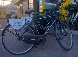 a bike parked on the street with a sign on it at I Cinque Angeli in Polignano a Mare +8 photos