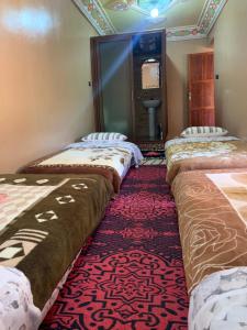 A bed or beds in a room at Gite Tawada
