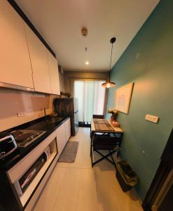 A kitchen or kitchenette at THE BASE apartments at central pattaya