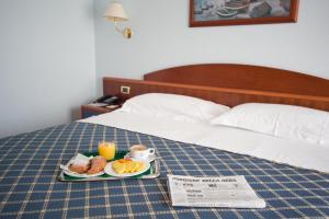 Postelja oz. postelje v sobi nastanitve Hotel Levante