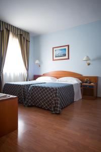 Postelja oz. postelje v sobi nastanitve Hotel Levante