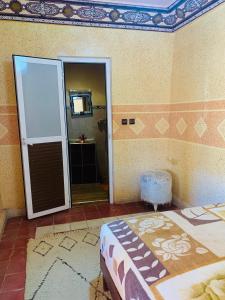 A bed or beds in a room at Gite Tawada