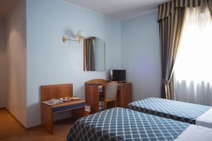 Postelja oz. postelje v sobi nastanitve Hotel Levante