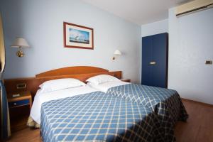 Postelja oz. postelje v sobi nastanitve Hotel Levante
