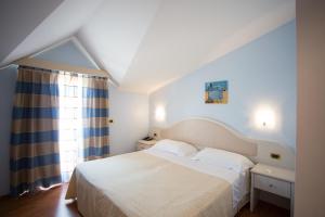 Postelja oz. postelje v sobi nastanitve Hotel Levante