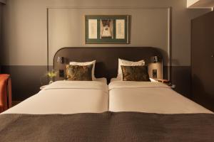 Uma cama ou camas num quarto em Hotel Hasselbacken