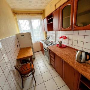 Kuchyň nebo kuchyňský kout v ubytování Apartament Centrum
