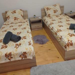 a bedroom with a bed with shoes on it at КРУШУНСКИ КЪТ ТЕЯ in Krushuna