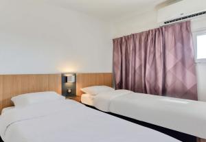 Postel nebo postele na pokoji v ubytování B&B HOTEL Béziers