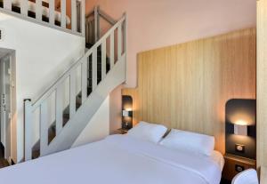 Postel nebo postele na pokoji v ubytování B&B HOTEL Béziers