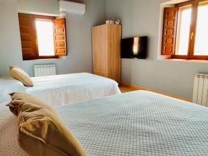 Postel nebo postele na pokoji v ubytování Casa rural Cal Codina