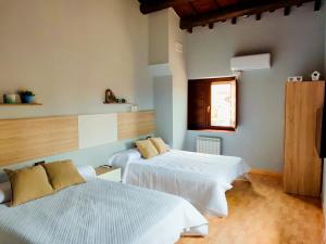 Postel nebo postele na pokoji v ubytování Casa rural Cal Codina
