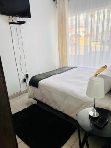 Postel nebo postele na pokoji v ubytování Zindiza Air BnB