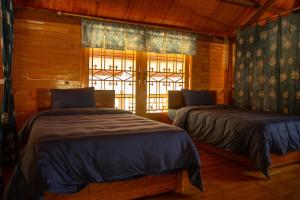Postel nebo postele na pokoji v ubytování Khen Mong Nature Hotel