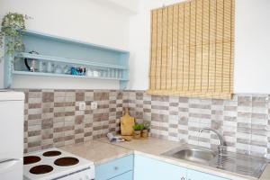 Kuchyň nebo kuchyňský kout v ubytování Airy Flat at Xenios Avlais + 17 fotografií