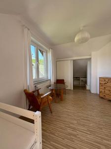 an empty room with a bed and a table at Apartament u Zosi in Wisełka