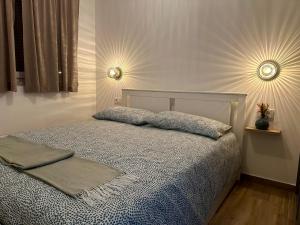 a bedroom with a bed with two pillows on it at Apartment Giò in Tar