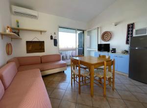 a living room with a couch and a table at Gallura da Cino in Badesi