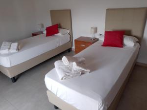 Postel nebo postele na pokoji v ubytování Vinci Residence - VR