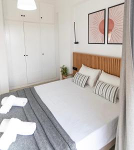 Postel nebo postele na pokoji v ubytování Airy Flat at Xenios Avlais