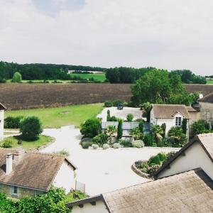 an aerial view of a house with a driveway at Domaine de la RIMBERTIÈRE in Thuré