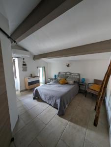 a bedroom with a bed in the middle of a room at Casa Ditta in Mela