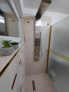 a bathroom with a shower stall and a window at Gímes Apartman in Cserszegtomaj +64 photos