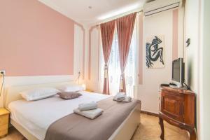 Postel nebo postele na pokoji v ubytování Giovanna Boutique Rooms & Pool