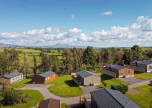an aerial view of a farm with houses at Docker Holiday Park in Carnforth