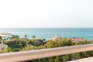 a view of the ocean from a balcony at Relaxing Sea View Studio at Xenios Avlais in Alikanas