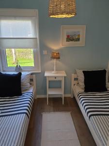 Katil atau katil-katil dalam bilik di Ferienhaus Grosses Meer mit Ruderboot