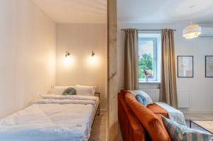 a bedroom with two beds and a window at Apartment Quiet Street 11/1E in Oświęcim