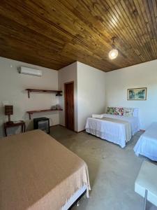 En eller flere senge i et værelse på Pousada Luar de Caraíva