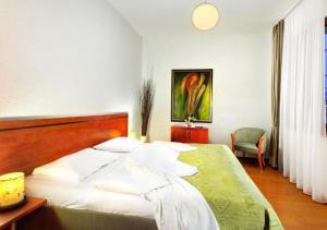 Letto o letti in una camera di Hotel Bešeňová