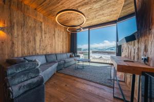 a living room with a couch and a table at Mountain View in Kaltenbach