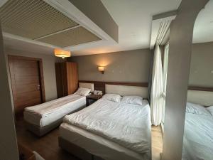 A bed or beds in a room at Reikartz 2017