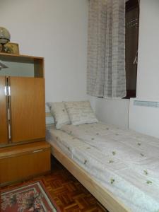 En eller flere senge i et værelse på Apartment Košuta A2