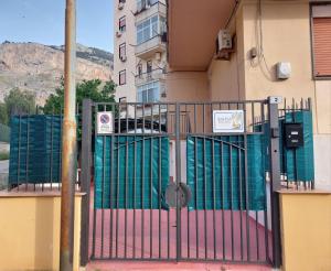 a gate in front of a building at Kalisa Home, B&B e Casa Vacanza Palermo in Capaci