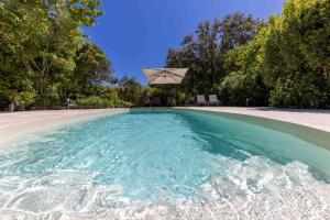 a pool of water with a basketball hoop at 06BV2 Nice cottage with pool in Grasse