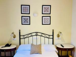 Łóżko lub łóżka w pokoju w obiekcie Hotel Torre San Juan