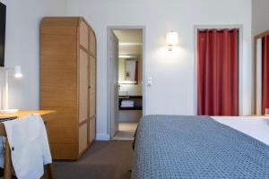 Postel nebo postele na pokoji v ubytování Hôtel Boutique Cézanne centre Aix-en-Provence