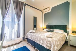 Postel nebo postele na pokoji v ubytování Giovanna Boutique Rooms & Pool