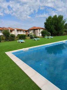 a swimming pool in the yard of a house at Lighthouse 3 bedrooms villa F36 in Balchik