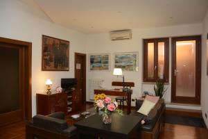 a living room with a couch and a table at Albergo Italia in Piombino