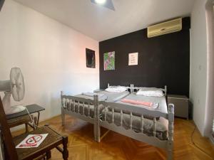 Letto o letti in una camera di SAGR ROOMS shared toilet and kitchen