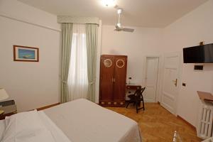 TV a/nebo společenská místnost v ubytování Albergo Italia