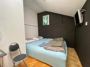 Letto o letti in una camera di SAGR ROOMS shared toilet and kitchen